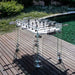 Teckell Fuoriclasse Foosball Table placed on a wooden deck by the water, emphasizing its luxurious and modern appeal.