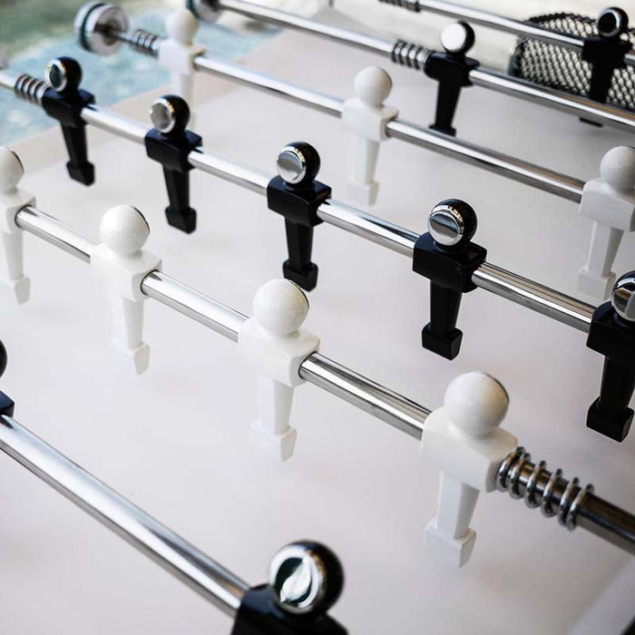 Teckell Fuoriclasse Foosball Table's players in black and white, showcasing the minimalist design.