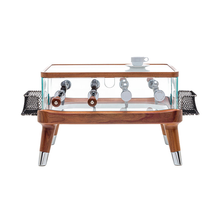 A sleek side view of the Teckell Intervallo Foosball Coffee Table highlighting its polished chrome rods and finely crafted Canaletto walnut structure.