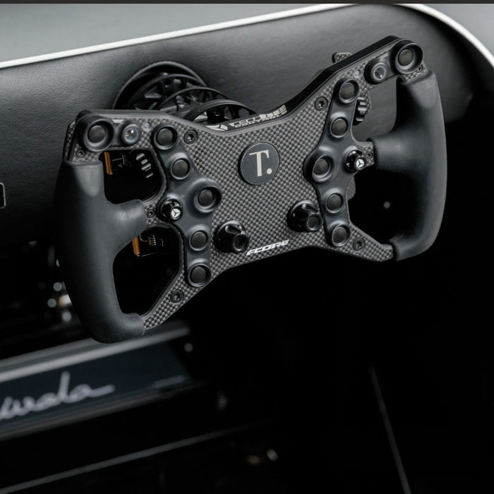 Carbon fibre racing steering wheel for the Teckell Nivola Racing Simulator with professional simulator controls.