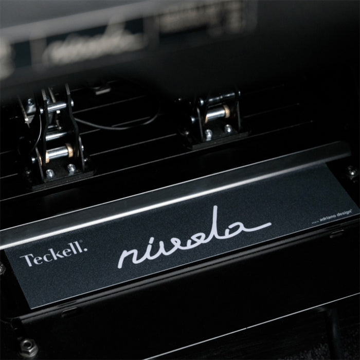 Precision pedal box inside the Teckell Nivola Racing Simulator featuring Nivola limited edition branding.