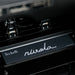 Precision pedal box inside the Teckell Nivola Racing Simulator featuring Nivola limited edition branding.