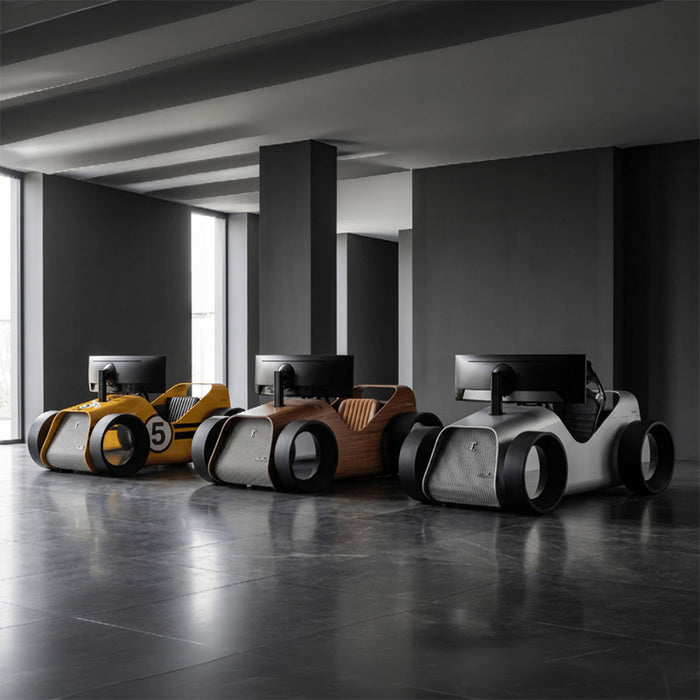 Teckell Nivola Racing Simulator displayed in walnut, silver and yellow finishes, showcasing luxury racing simulator cockpits in a contemporary interior.