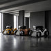 Teckell Nivola Racing Simulator displayed in walnut, silver and yellow finishes, showcasing luxury racing simulator cockpits in a contemporary interior.