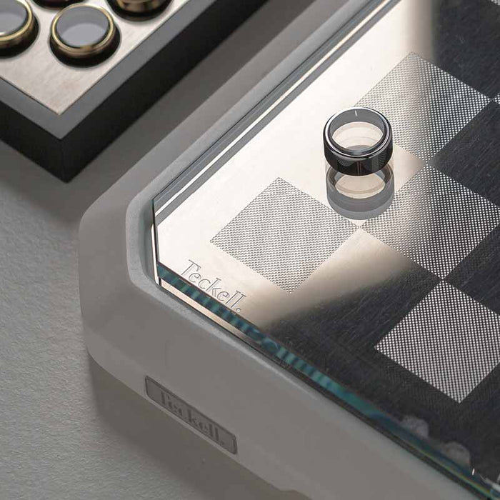 Illuminated view of the Stratego White Marble Game Board, showcasing its stunning design and luxurious appeal in a well-lit environment.