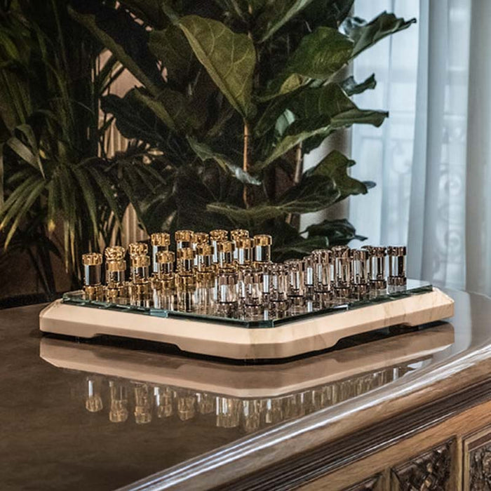 The Marble Game Board elegantly displayed on a modern table, set against a backdrop of lush greenery.