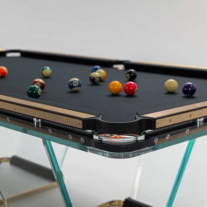 Angled side view of the Teckell T1.3 pool table, featuring the combination of glass and gold elements