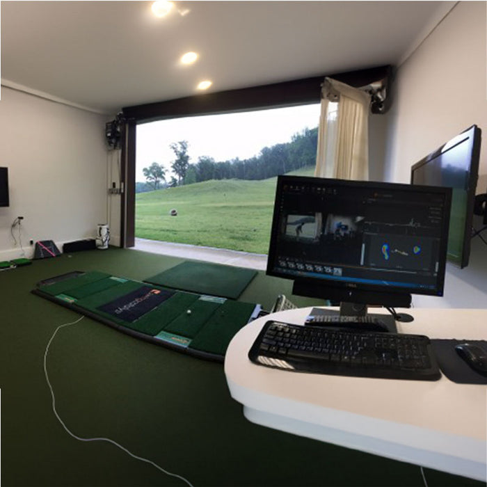 True Strike Double mat set up with an indoor golf simulator and computer.