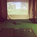 True Strike Single golf mat in an indoor setting with golf equipment.