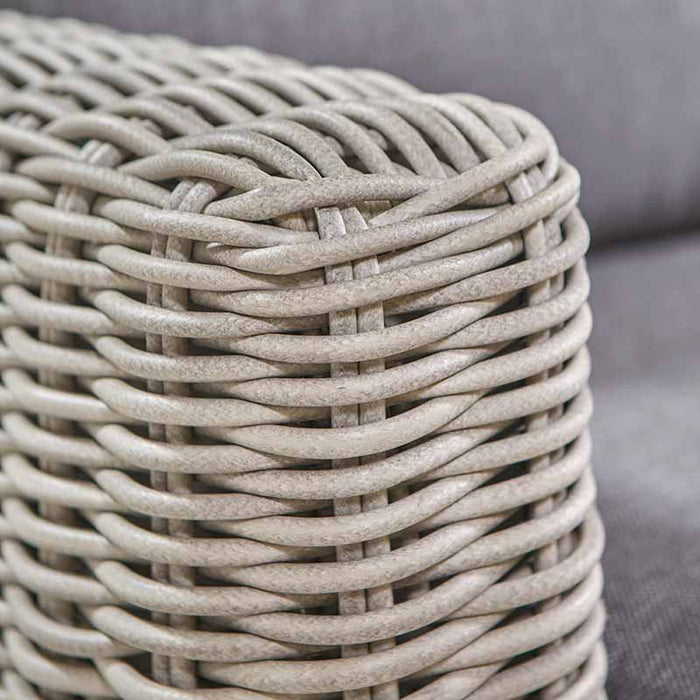 A close-up of the armrest, displaying the intricate rattan weave and smooth finish of the Tuscany Outdoor Corner Seating Set.