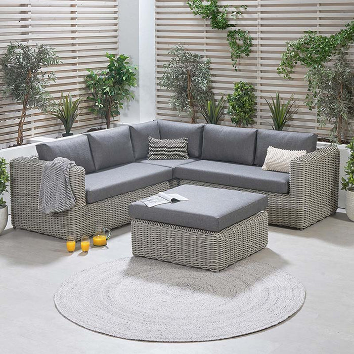 A stylish Tuscany Outdoor Corner Seating Set with deep cushions, designed to enhance outdoor spaces with comfort and elegance.