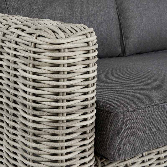 Close-up of the Tuscany Outdoor Seating Set, showing the fine texture of the grey rattan weave and the soft anthracite cushions, designed for comfort and style.