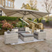 Tuscany Outdoor Seating Set in a garden setting with cool grey rattan and plush anthracite cushions under a parasol.