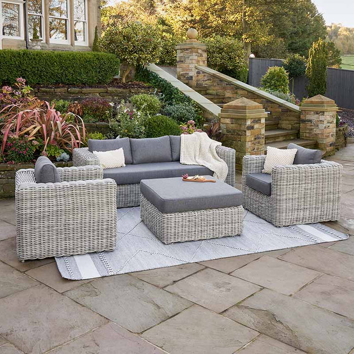 Elegant Tuscany Outdoor Seating Set in a garden setting, featuring cool grey rattan and plush anthracite cushions, perfect for stylish and comfortable outdoor lounging.