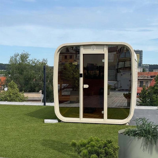 Ula Classic 6-person sauna in a whitewashed finish, elegantly placed on a rooftop terrace with city views, ideal for premium outdoor wellness.