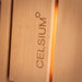 Close-up of CELSIUM logo engraved on the interior timber of the Ula Grand 6-person outdoor sauna.
