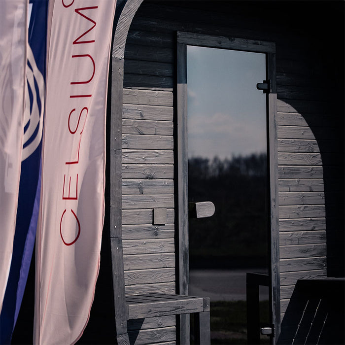 Front detail of the Ula Grand 6-Person Outdoor Sauna in Ebony finish showing the entrance and exterior cladding