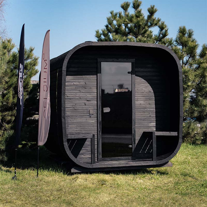 Front exterior view of the Ula Grand 6-person outdoor sauna in ebony finish with full glass door.