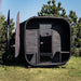 Front exterior view of the Ula Grand 6-person outdoor sauna in ebony finish with full glass door.