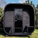 Ula Grand 6-person outdoor sauna in ebony finish shown from the front with CELSIUM flags in the foreground.