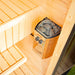 Close-up of the Ula Micro 2-person outdoor sauna interior, showing the smooth timber bench seating and Harvia heater with sauna stones for an authentic wellness experience.