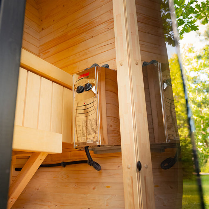 Interior shot of the Ula Micro 2-person outdoor sauna featuring a Harvia heater, clean wooden panelling, and ergonomic bench seating for cosy heat sessions.