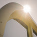 Close-up shot of the curved sauna roof structure under bright sunlight, highlighting its weather-resistant build.