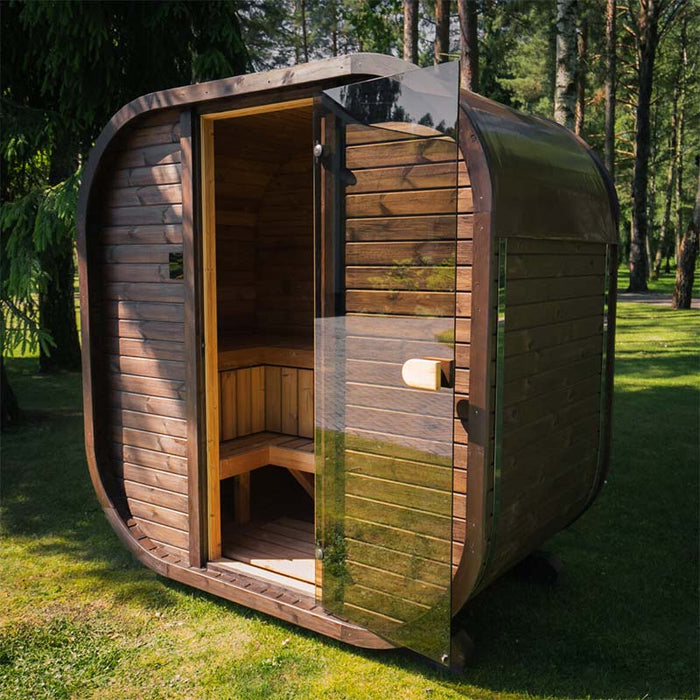 Front view of the Ula Mini outdoor sauna with open glass door revealing wooden interior seating.