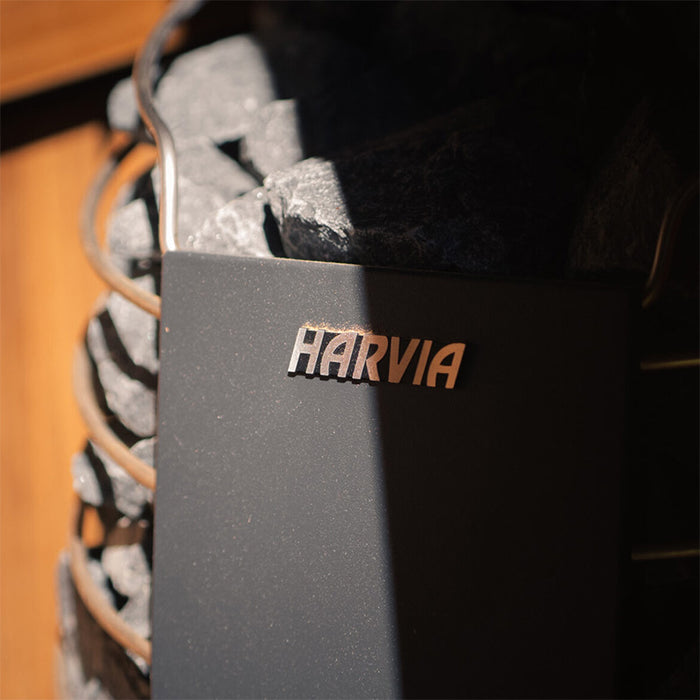 Harvia branded heater with sauna stones inside the Ula Mini 2-person outdoor sauna for an authentic sauna experience.