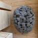 Interior view of the Ula Mini sauna featuring a HUUM heater with stones and light wooden benches.