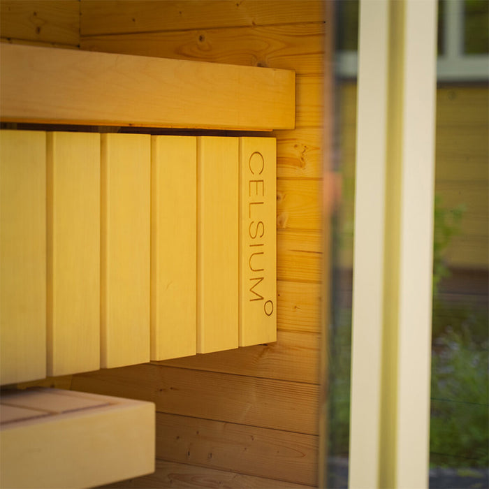 Interior wooden seating of the Ula Mini sauna featuring engraved CELSIUM branding.