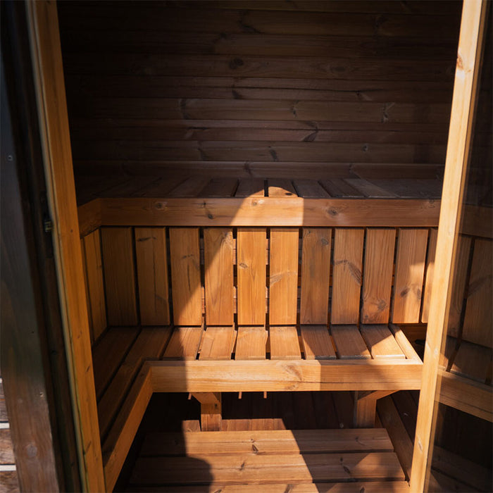 Open door view of the Ula Mini sauna interior with tiered wooden seating, ideal for two people.