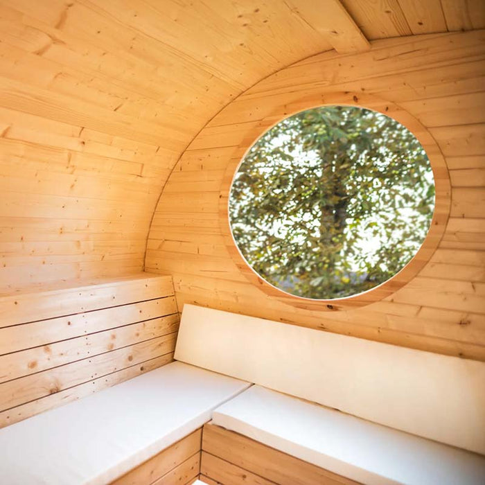 Interior view of Delight Outdoor Sauna  showing benches and round window.