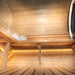 Close-up interior view of Delight Sauna 2.4 x 4.3m with towels and bucket on wooden benches.