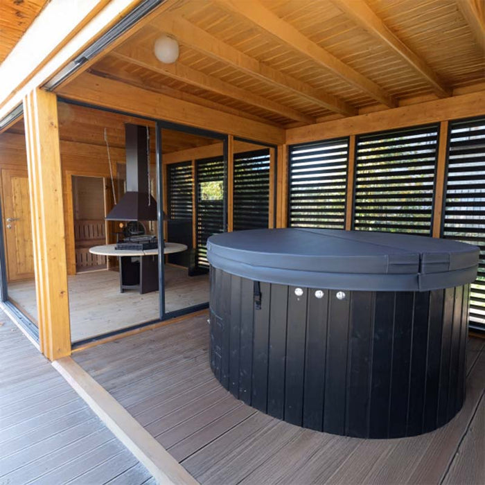 Interior shot of the compact and convenient shower room for post-sauna refreshment.