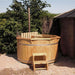 Hot Tub from Thermowood with a wood stove in a garden.