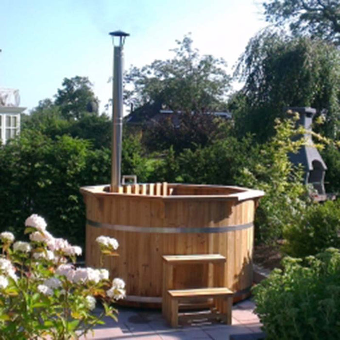 Hot Tub from Thermowood with a chimney in a garden.