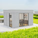 Insulated Garden Man Cave Cube 3 x 4m set amidst lush greenery, showcasing the sleek exterior with modern glass doors and sunscreen wall for privacy.