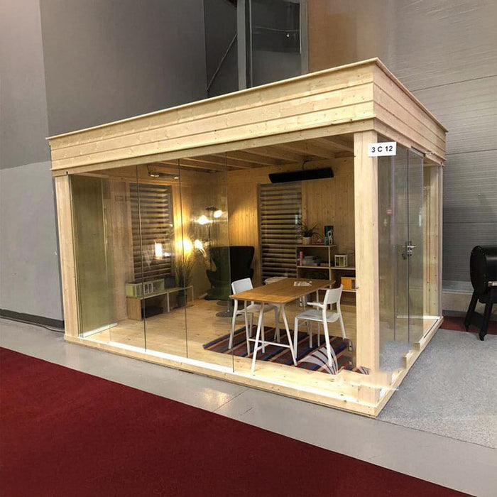 Insulated Garden Office Cube 3 x 4m in showroom setting with natural wood cladding, showcasing a cosy and modern workspace with large glass panels.