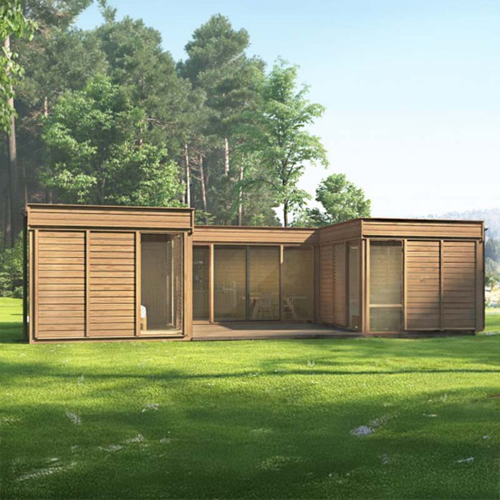 Lifestyle image of the Viking Industrier Insulated Glamping Cube 51m² U-Shape in a lush outdoor setting, perfect for luxurious retreats.