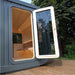 Side view of Luna Outdoor Sauna with open door.