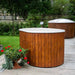 Fiberglass Ofuro Hot Tub with a white interior, situated on a deck with a garden setting.