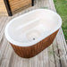 Top view of an empty Fiberglass Ofuro Hot Tub with a white interior, placed on a deck.