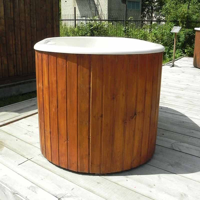 Fiberglass Ofuro Hot Tub with a white interior, on a deck in a garden.