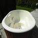 Interior view of a white, empty Fiberglass Ofuro Hot Tub with seating.