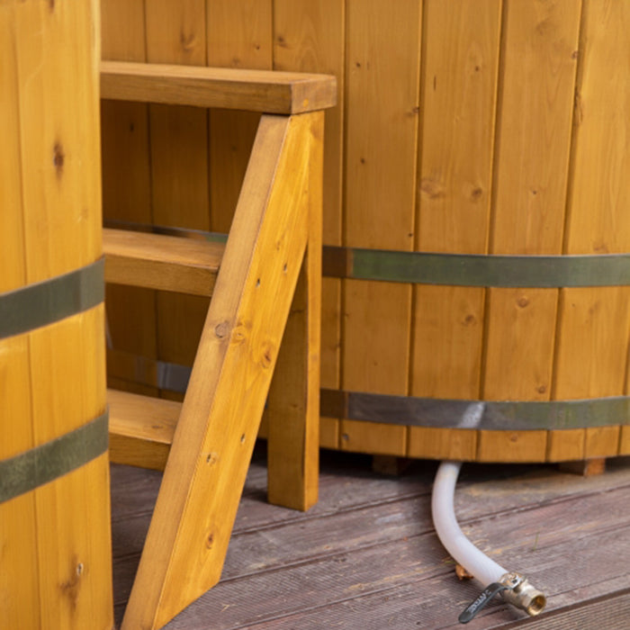 Wooden steps and hose attachment on the oval cold tub.