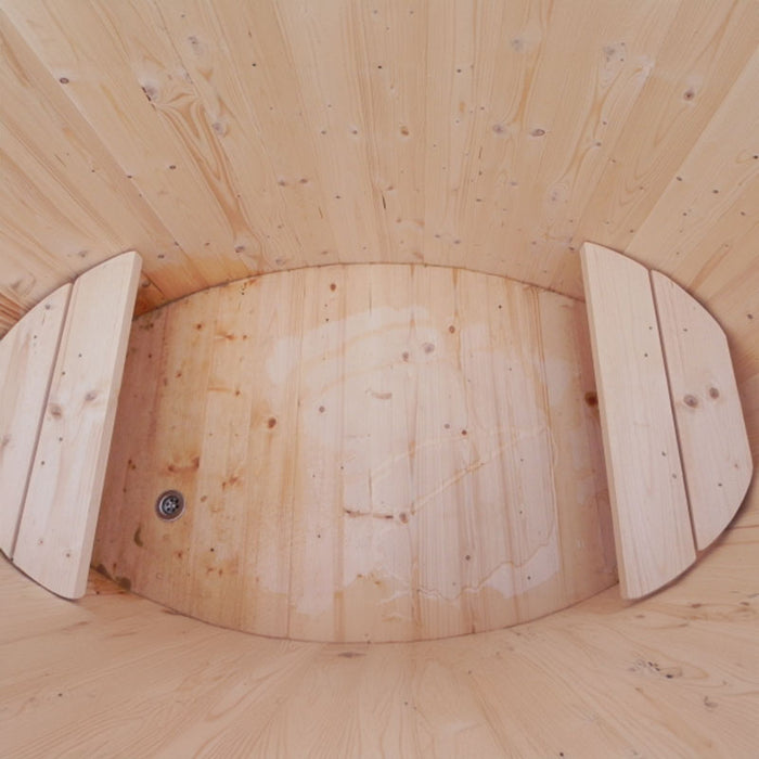 Interior of the oval cold tub with wooden seating.