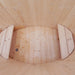 Interior of the oval cold tub with wooden seating.