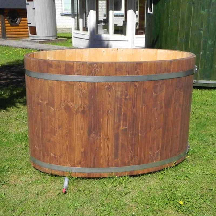 Oval cold tub with a wooden lid, placed on the grass.