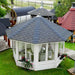 Aerial view of the Pavilion 10m² Sun, highlighting its octagonal structure, black shingle roof, and white window frames in a garden setting.